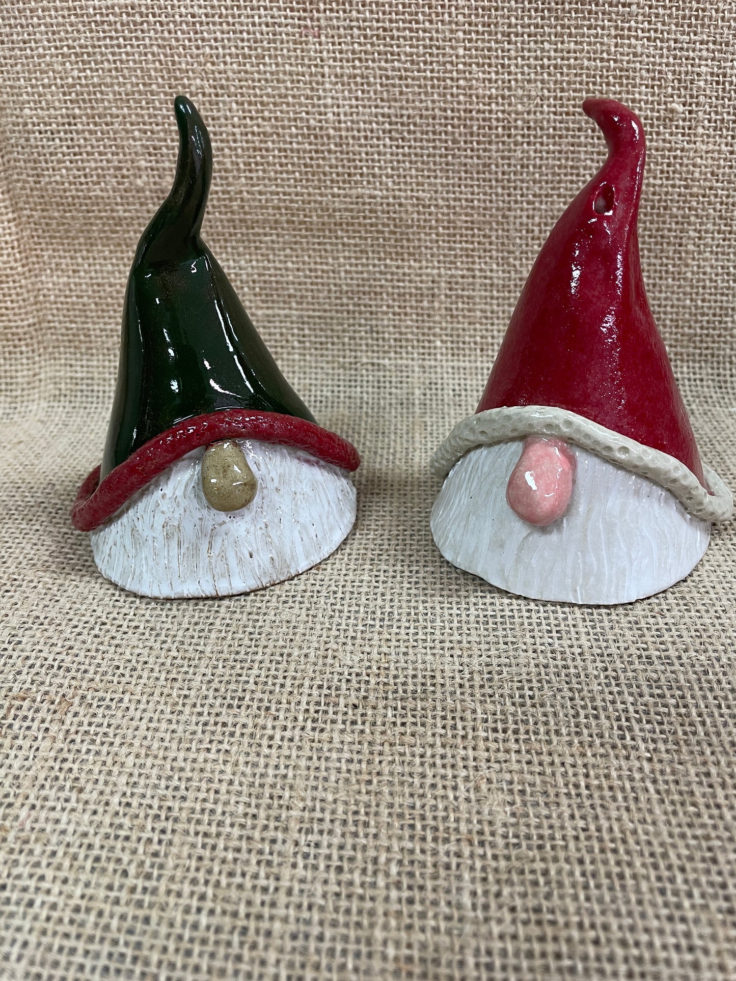 Image of 2 pottery santa christmas decorations.