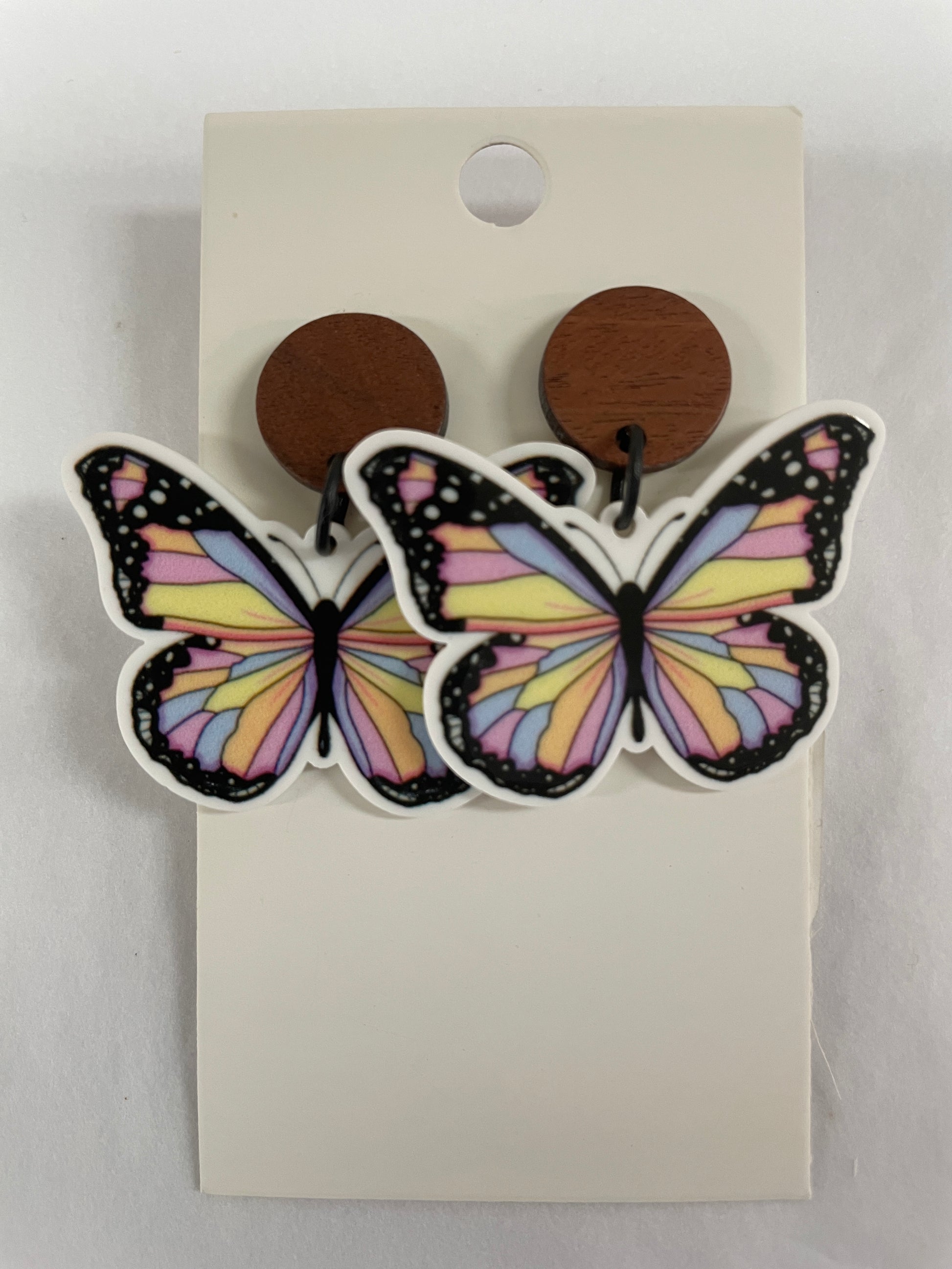 Beldari Pottery handmade butterfly resin dangle earrings with dark timber stud tops.