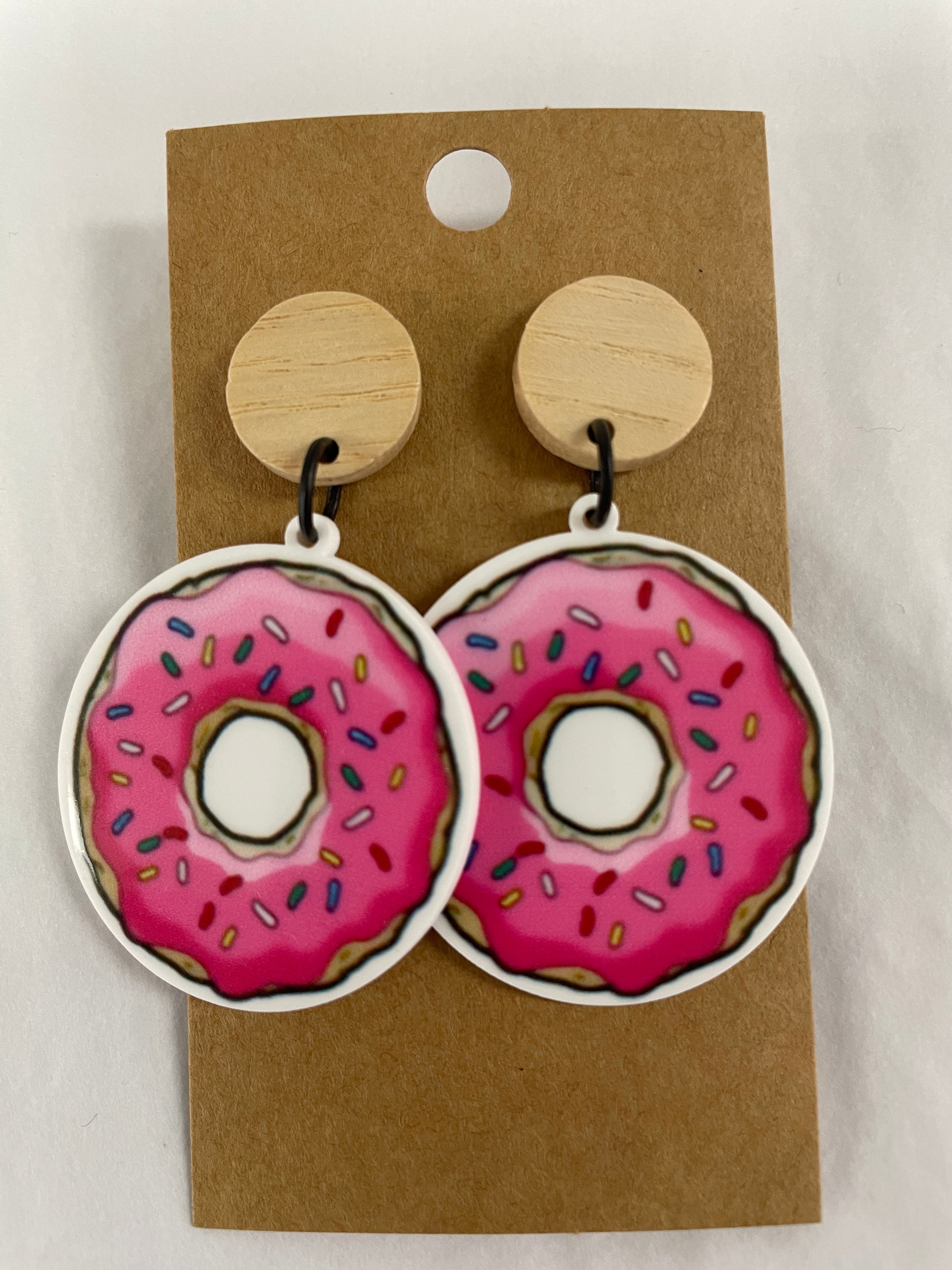 Pink iced donut resin dangle earrings with natural timber stud tops by Beldari Pottery.