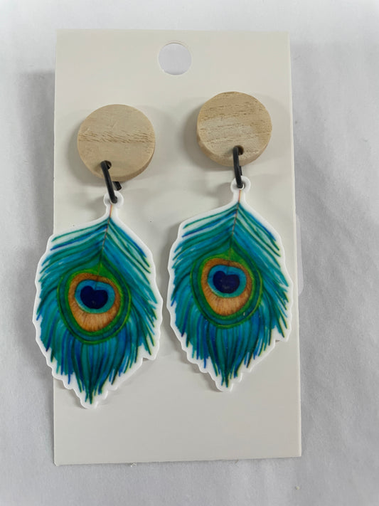 Peacock feather resin dangle earrings featuring one colourful peacock feather on each earring with natural timber stud tops by Beldari Pottery.
