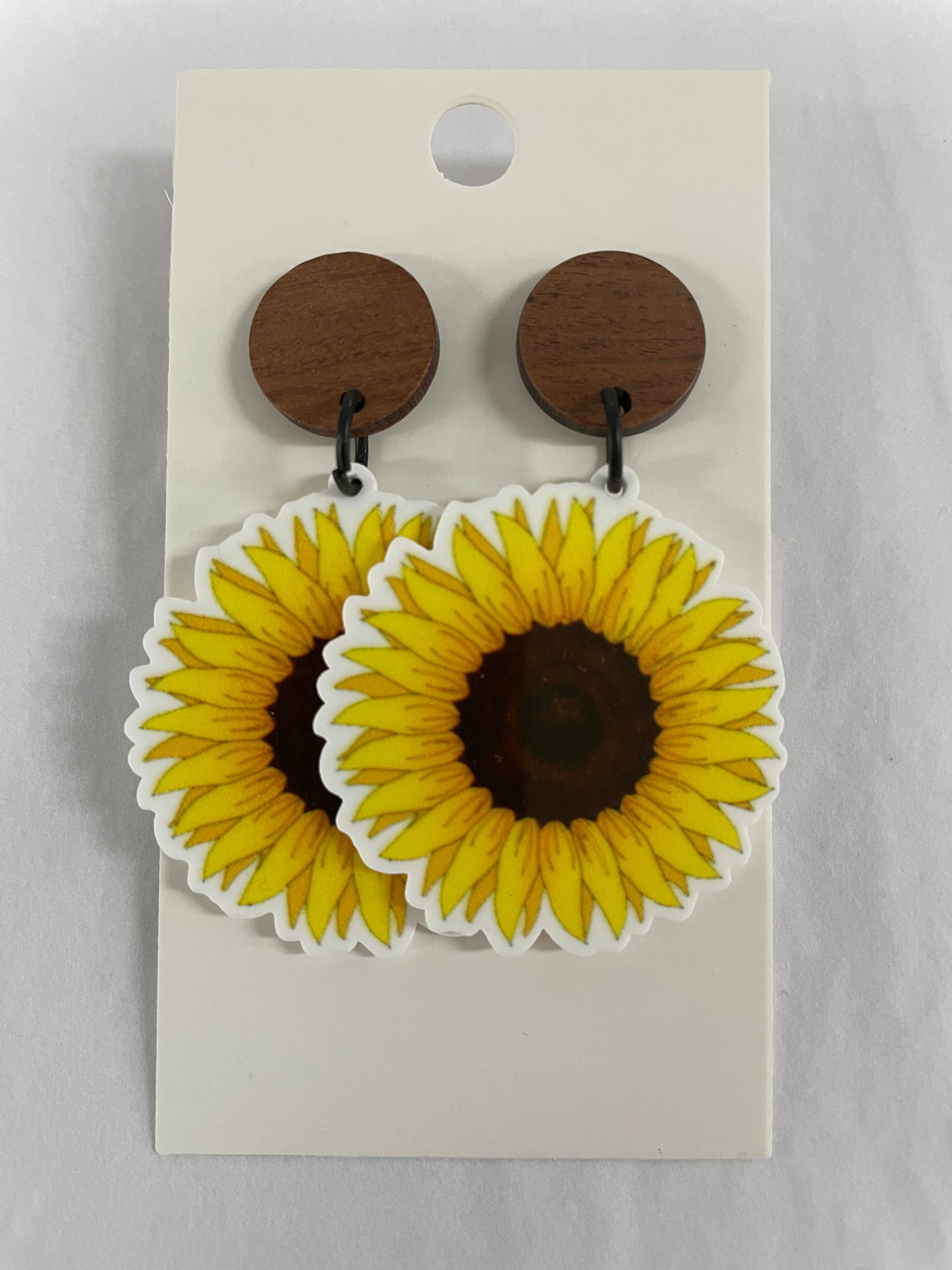 Sunflower resin dangle earrings featuring one vibrant sunflower on each earring with natural timber stud tops by Beldari Pottery.