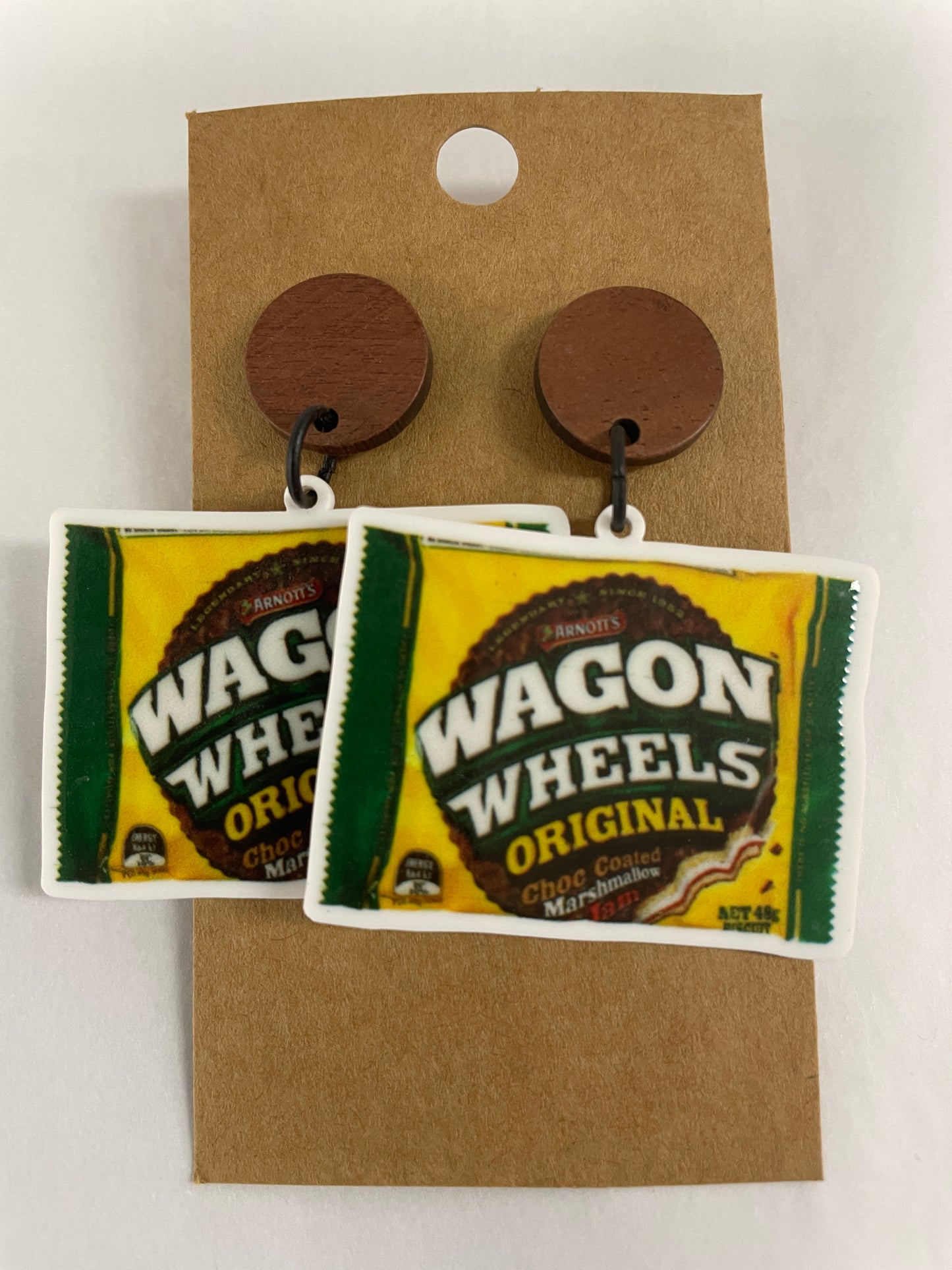 Fun Wagon Wheel packet resin dangle earrings featuring one packet on each earring with natural timber studs. A quirky nostalgic gift by Beldari Pottery.